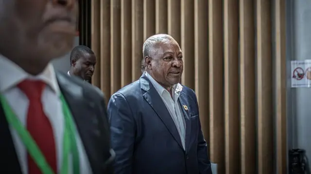 John Dramani Mahama, President of di Republic of Ghana, waka toward a bilateral meeting during di 39th Ordinary Session of di Assembly of di African Union for di AU Headquarters in Addis Ababa on 15 February 2026.