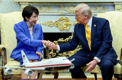 U.S. President Donald Trump shakes hands with Japanese Prime Minister Sanae Takaichi in the Oval Office at the White House in Washington, D.C., U.S., Thursday.