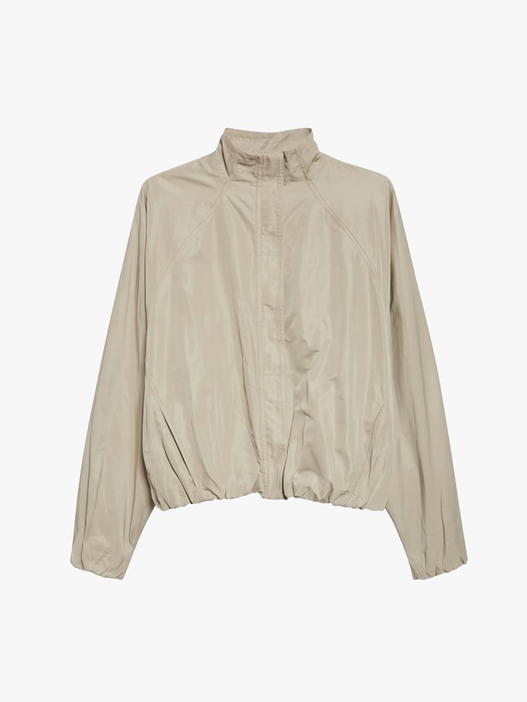 Image may contain: Blouse, Clothing, Coat, Jacket, Long Sleeve, and Sleeve