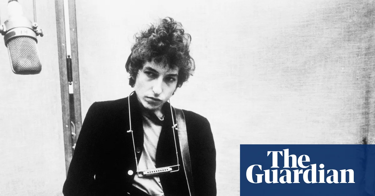 ‘Extremely rare’ Bob Dylan draft lyrics discovered inside Allen Ginsberg book | Bob Dylan