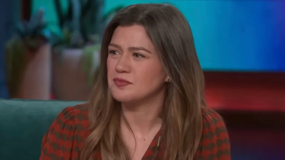  Kelly Clarkson in red and green shirt hosting episode of The Kelly Clarkson Show 2026. 