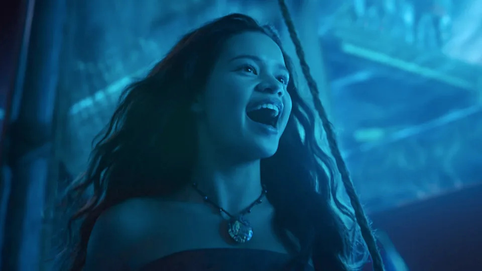  Catherine Lagaʻaia as Moana singing with blue light on her . 