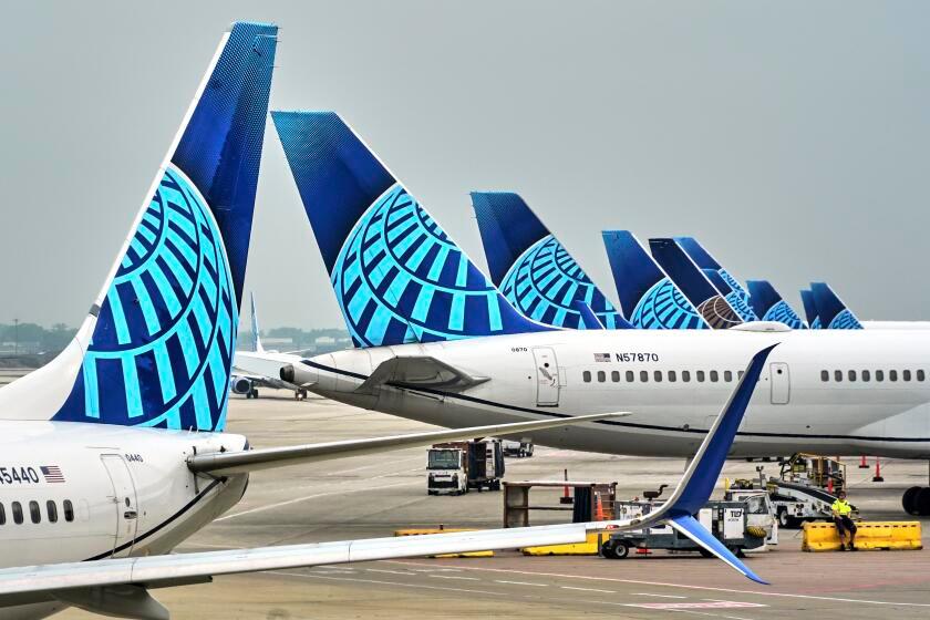 United Airlines jets are lined up at their gates at O'Hara International Airport in Chicago on Thursday, May 29, 2025. (AP Photo/Gene J. Puskar)