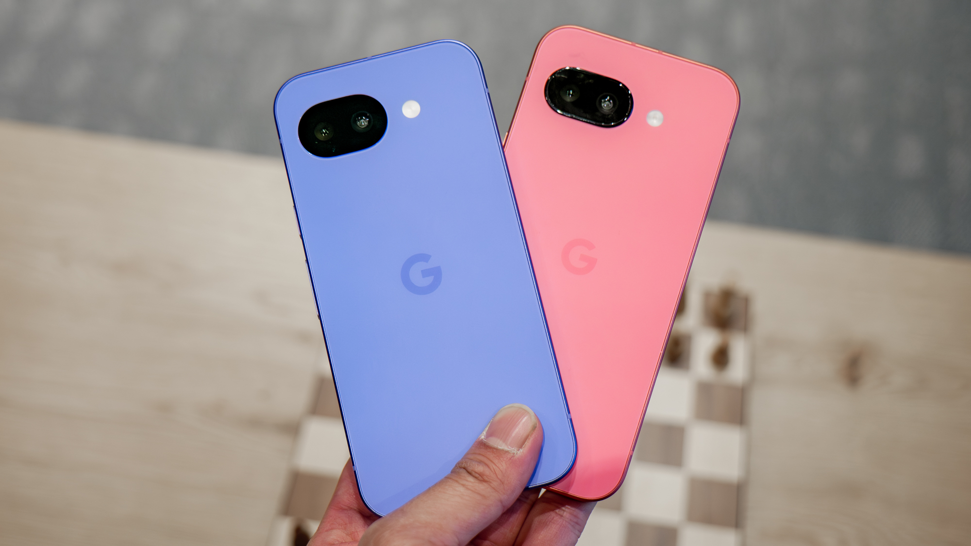 Pixel 10a vs Pixel 9a held in the hand.