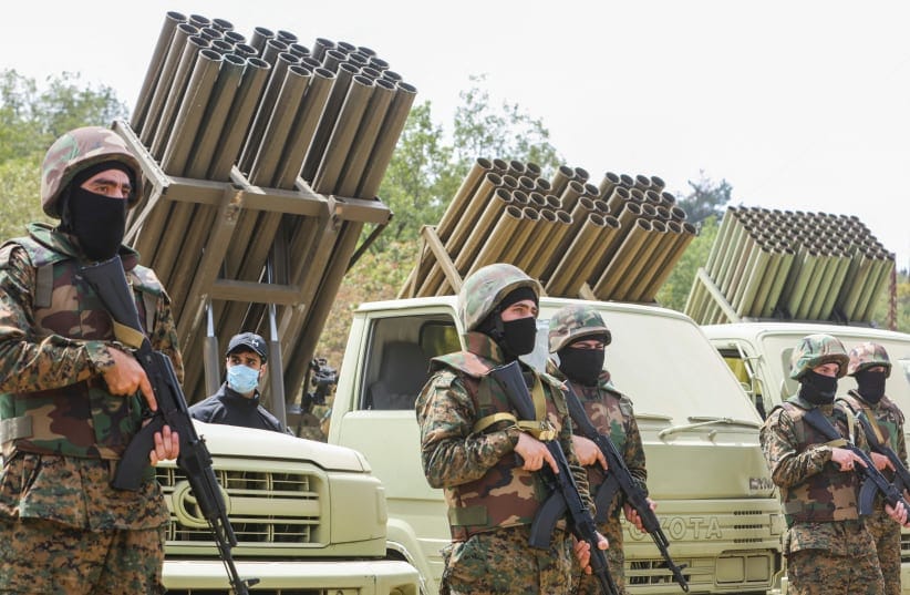  HEZBOLLAH MEMBERS take part in a military exercise during a media tour organized for the occasion of Resistance and Liberation Day, in Aaramta, Lebanon, last month.