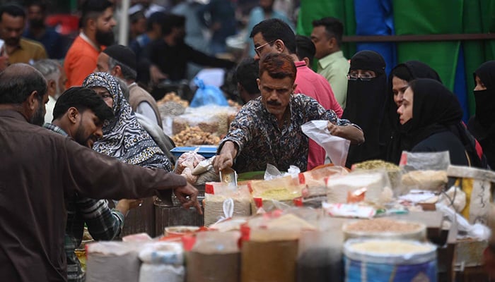 A vendor sells spice at a wholesale market in Karachi, on February 13, 2026. — INP