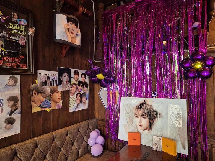 Photos of BTS members decorate the interior of JH Texas Bar in Jung District, central Seoul, Monday. Korea Times photo by Park Ung