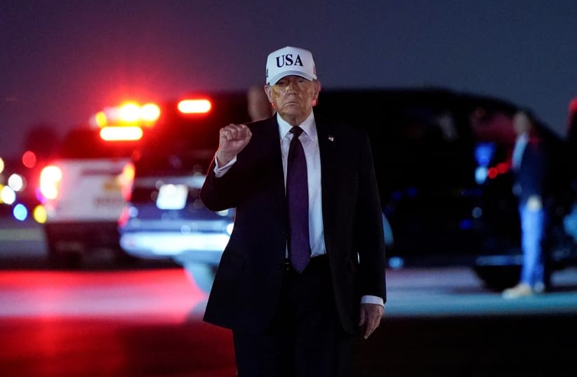 US President Donald Trump pumps his fist after disembarking Air Force One at Palm Beach International Airport in West Palm Beach, Florida, US, February 27, 2026