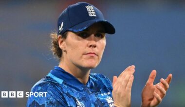 Nat Sciver-Brunt claps, wearing blue England one-day kit