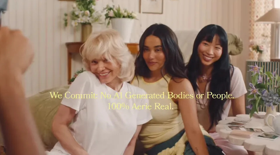 Three people smile at a table set for tea. Text over the image states a commitment to not using AI-generated bodies or people