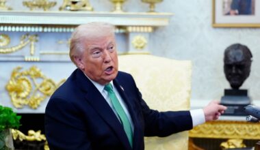President Donald Trump points to a bust of Winston Churchill as he speaks during a meeting with Irish Prime Minister Micheál Martin in the Oval Office of the White House, on St. Patrick's Day, Tuesday, March 17, 2026, in Washington. (AP Photo/Alex Brandon)