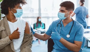 College students discussing meningitis vaccination during an outbreak response