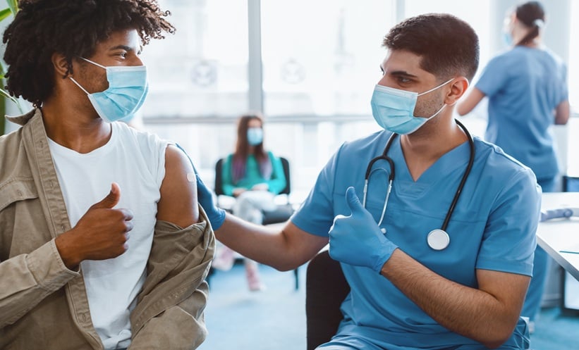 College students discussing meningitis vaccination during an outbreak response