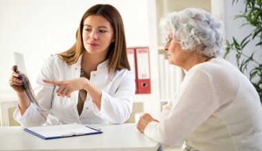 Doctor discussing scan results with patient during clinical consultation