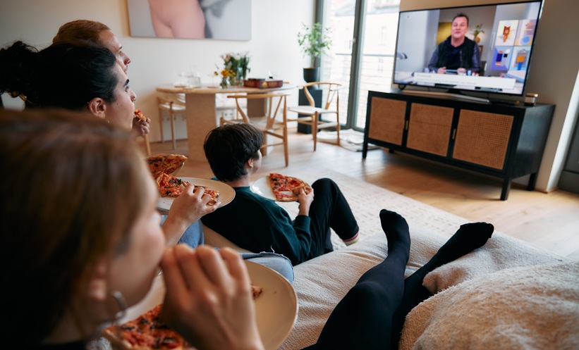 Gen Z college students reviewing HPV vaccination information on a phone and laptop