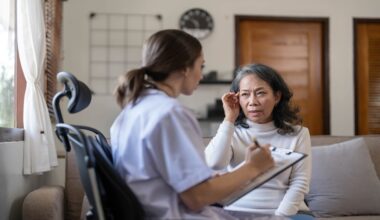Older adult undergoing hearing assessment during cognitive clinic evaluation for mild cognitive impairment