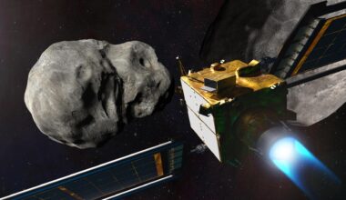 A spacecraft with solar panels heads for an asteroid in the darkness of space