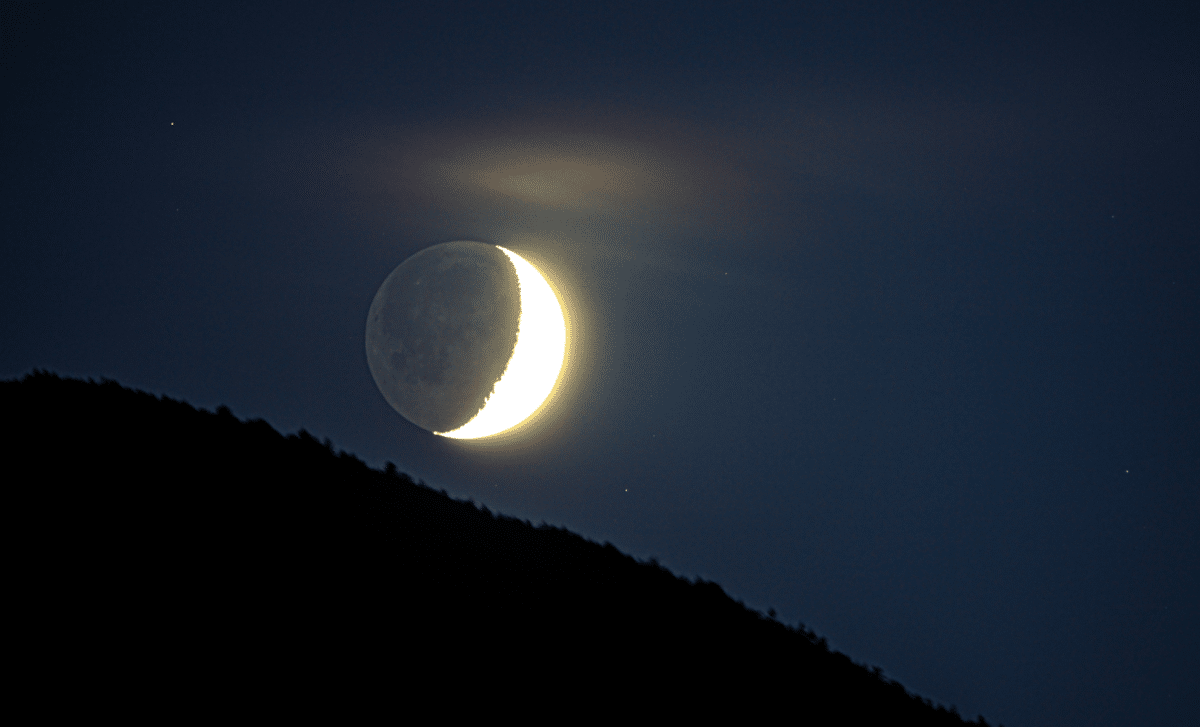 Catch The Soft Glow Of Earthshine On The Moon’s Hidden Surface Tonight