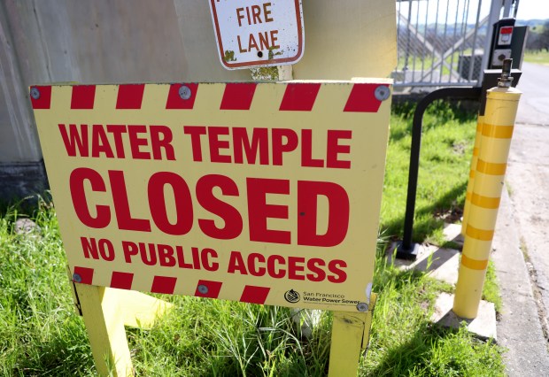 A closure sign is seen at the gate to the Sunol Water Temple in Sunol, Calif., on Thursday, Feb. 26, 2026. The San Francisco Public Utility Commission has yet to open the Alameda Creek Watershed Center more than 10 years after it was initially slated to be open. (Jane Tyska/Bay Area News Group)