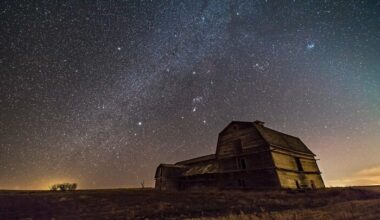 A starry night over a barn.