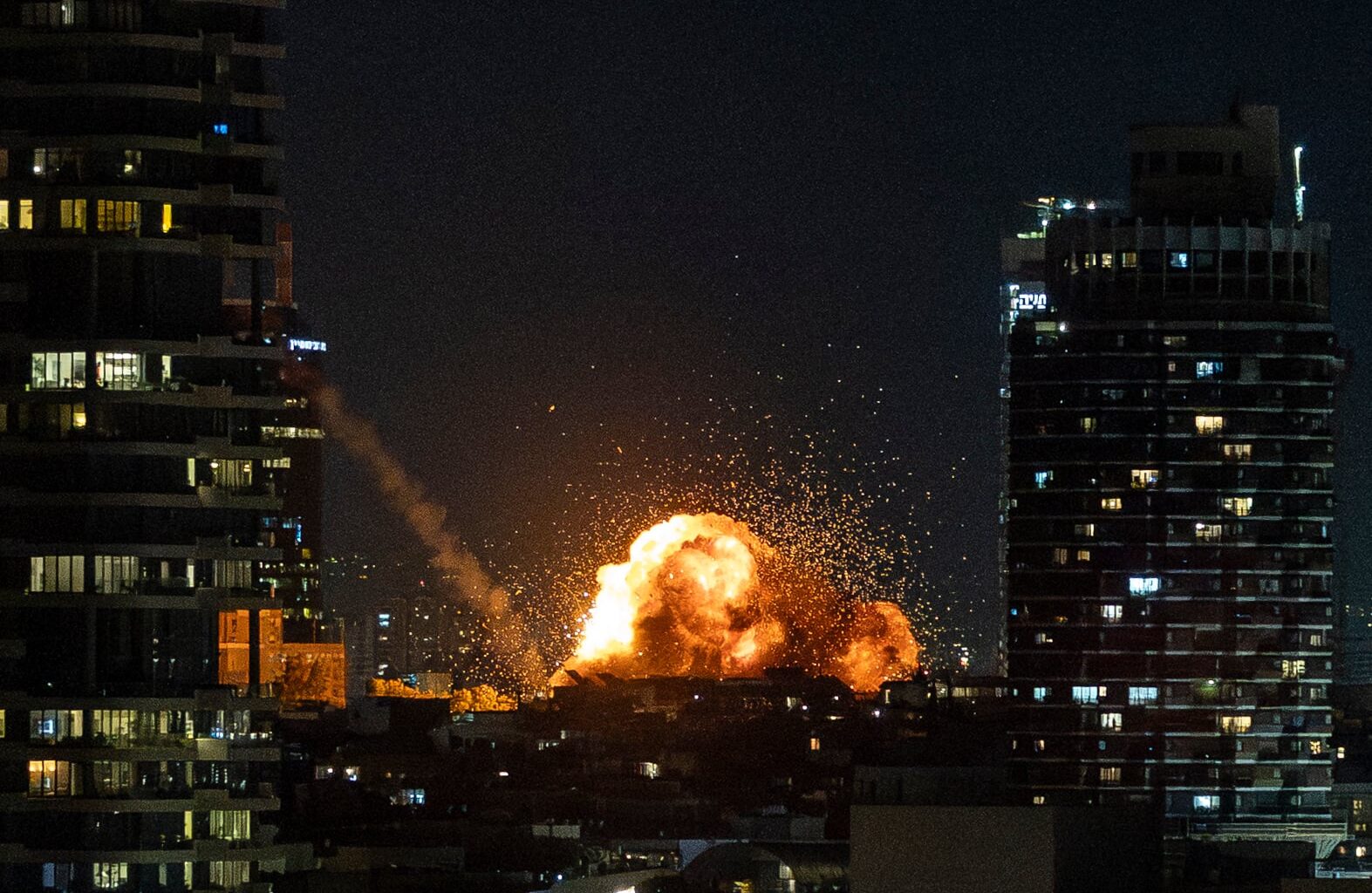 Woman killed, dozens injured as Iranian missile strikes Tel Aviv residential block - The Times of Israel