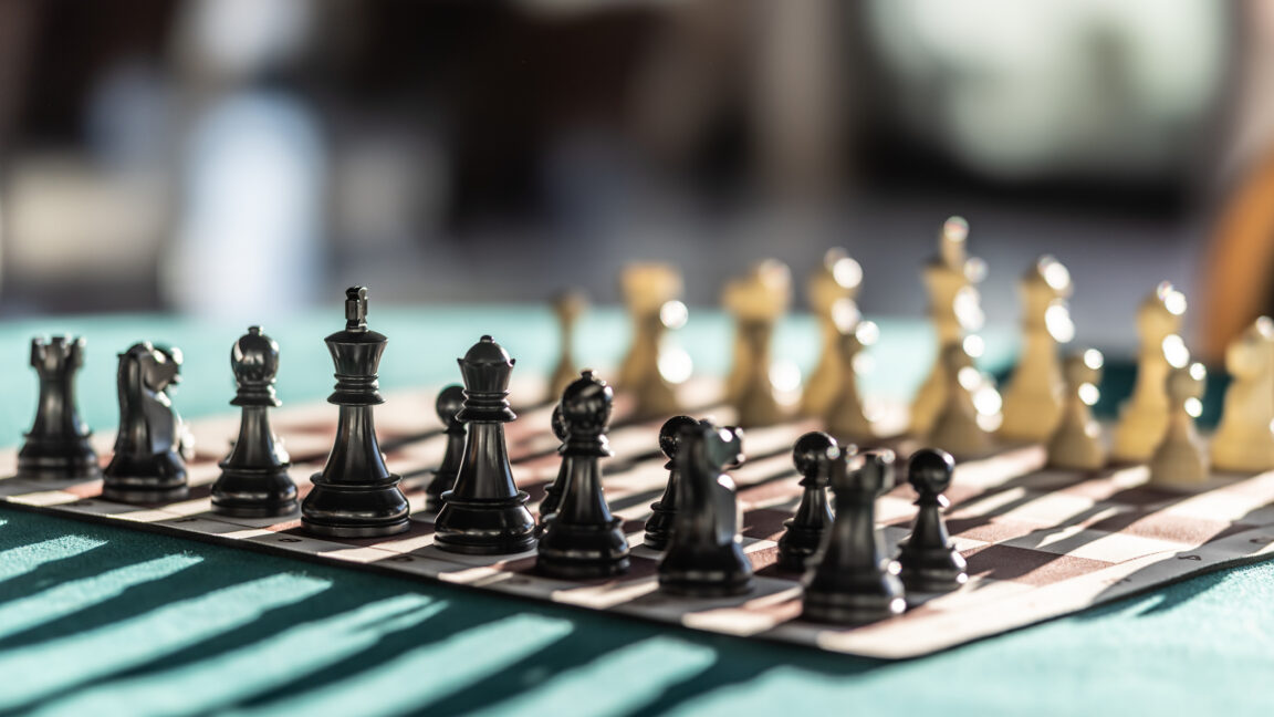Chess pieces arranged for the start of a chess game