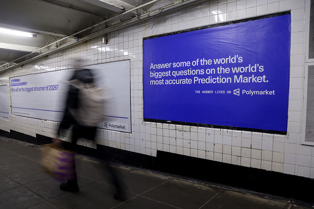 A Polymarket advertisement in a subway station in New York, US, on Thursday, Feb. 5, 2026. Kalshi and Polymarket, which have been assailed by critics for encouraging financial risk taking by making betting more accessible, are now using the promise of free groceries to win over New Yorkers.