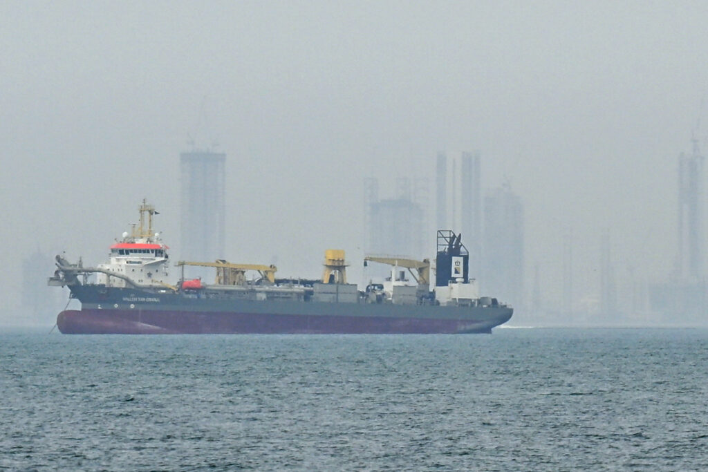 A commercial ship anchors off the coast of the United Arab Emirates due to navigation disruptions on Monday in the Strait of Hormuz, Dubai. Credit: Stringer/Anadolu via Getty Images