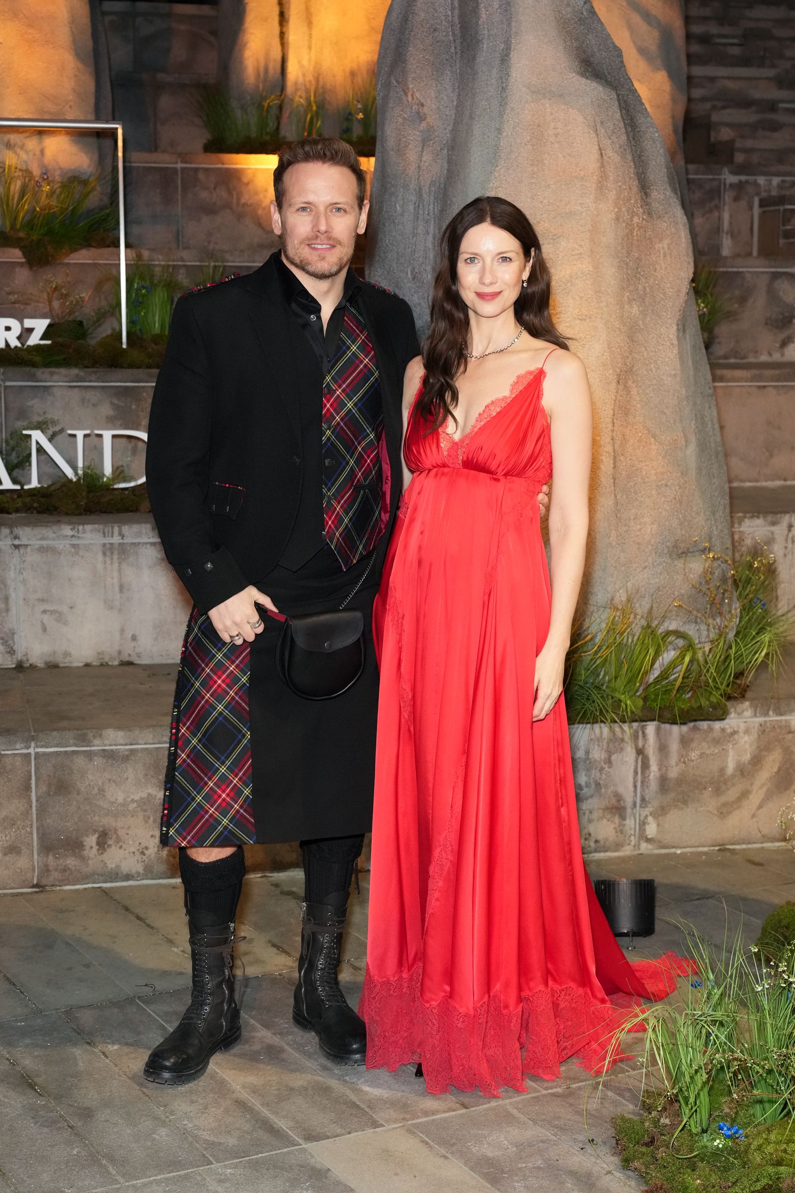 Image may contain Ben Price Caitriona Balfe Clothing Skirt Tartan Adult Person Coat Face and Head