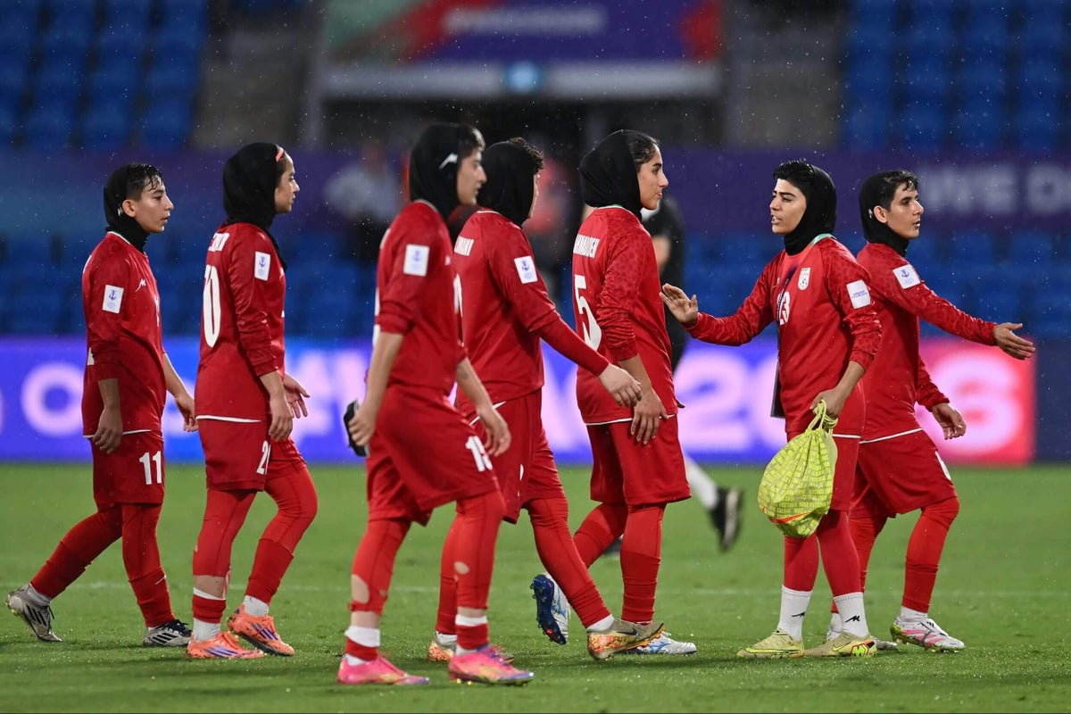 Iran football team returns home after week-long journey, two players remain in Australia