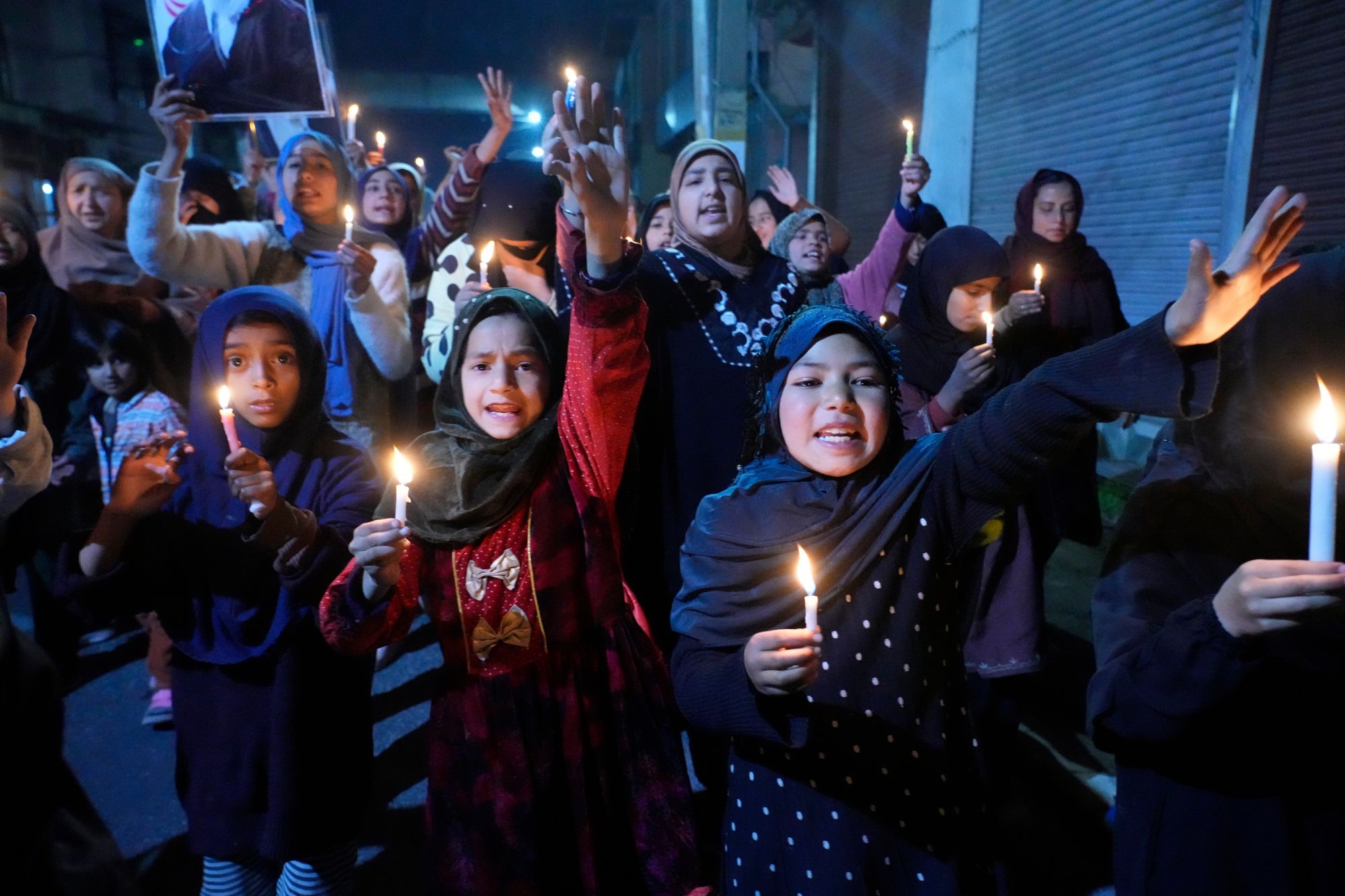 Shi’ite Muslims shout slogans during a candlelit protest against the killing of Iran's supreme leader Ayatollah Ali Khamenei, in Srinagar, Indian controlled Kashmir, Wednesday, 4 March 2026