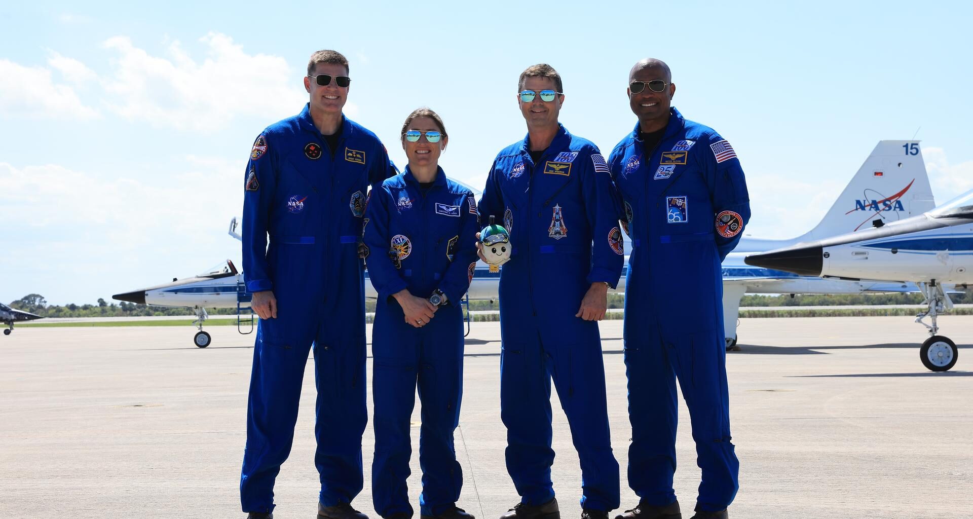 Image shows NASA's Artemis II astronauts dressed in their blue flight suit at the Launch and Landing Facility at NASA's Kennedy Space Center in Florida on Friday, March 27, 2026. Photo credit: NASA/Kim Shiflett