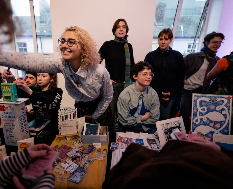 Hana Flamm (centre left) at a zine fair. Photograph: Rob Fay