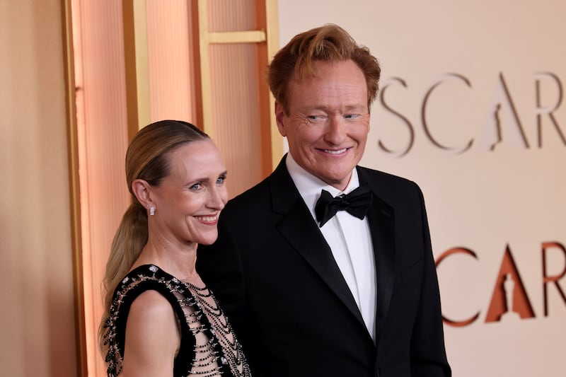 Oscars host Conan O'Brien (right) with his wife, Liza Powel O'Brien, at the Dolby Theatre. Photograph: Julian Hamilton/Getty Images