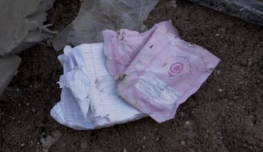 Pink schoolbook left behind in rubble tells story of 83 Lebanese children killed by Israel