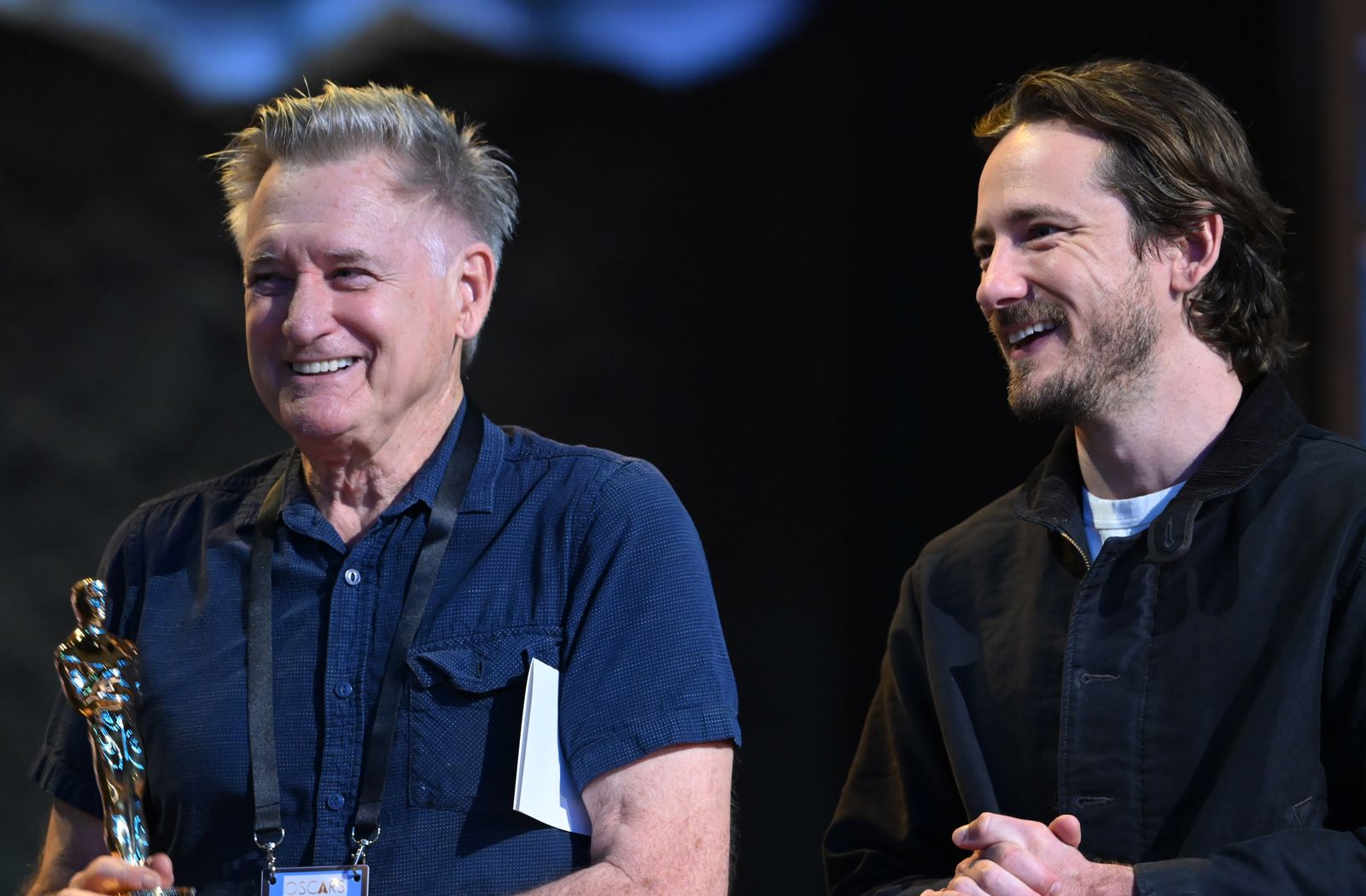 Image may contain Head Person Face Adult Happy Photography Portrait Laughing and Smile