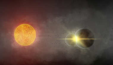 two large orbs colliding and creating a cloud of dust on a black background