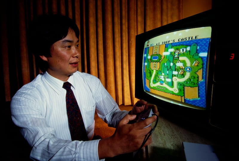 Shigeru Miyamoto, creator of Mario, plays Super Mario World on a Nintendo Super NES System. Photograph: Ralf-Finn Hestoft/Corbis/Getty