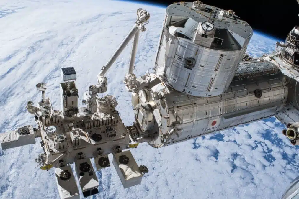 The Japanese Kibo Module On The International Space Station, Equipped With A Robotic Arm And Scientific Labs, As Seen From Space.