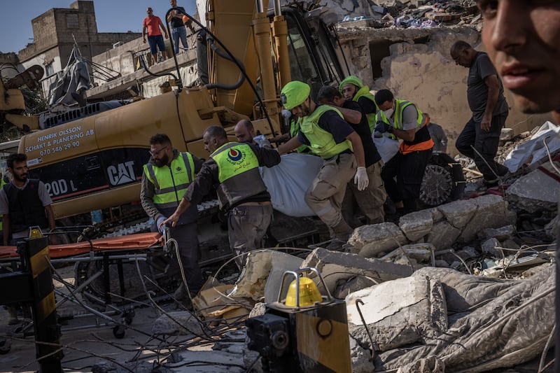 Emergency responders carry a body after it was extracted from a building that was destroyed in an Israeli airstrike a day earlier in Saida, Lebanon. Photograph: Ed Ram/Getty Images