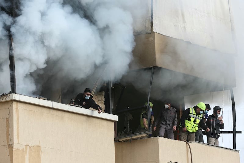 Emergency personnel at the site of an Israeli airstrike that targeted an apartment building in the southern Lebanese town of Saida.  Photograph: Mahmoud Zayyat/AFP/Getty Images