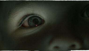 A close up of a child's eye that's blue. The image has a blue tint