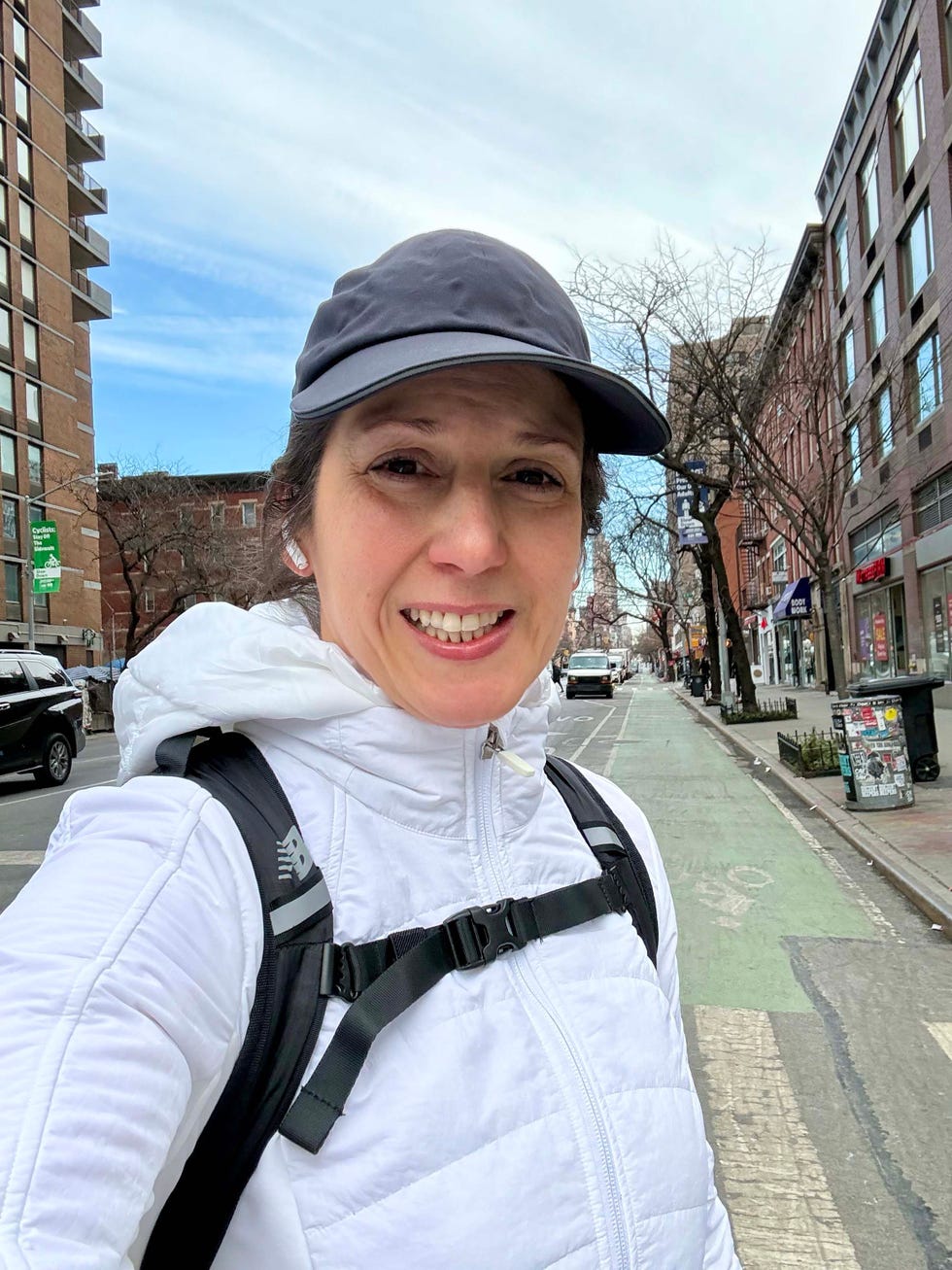 Pedestrian in a city street with buildings and vehicles. Pedestrian in a city street with buildings and vehicles.
