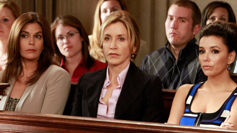 Susan Delfino, Lynette Scavo, and Gabrielle Solis sitting in a courtroom in Desperate Housewives.