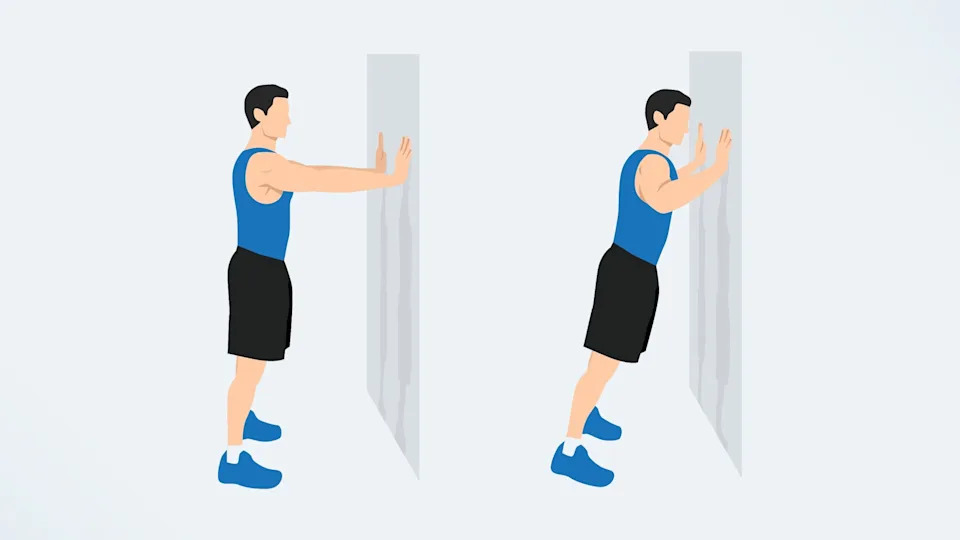 a man doing push ups on a wall