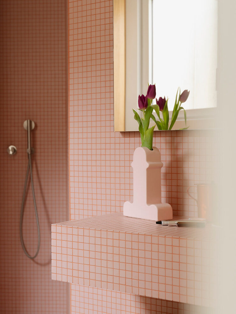 Shiva Vase by Ettore Sottsass matches the color palette of the bathroom