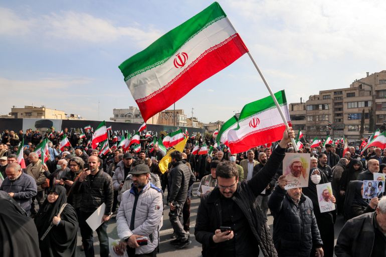 Demonstrators gather with Iranian national flags for a rally in support of the new Supreme Leader at Enghelab Square in central Tehran on March 9, 2026.