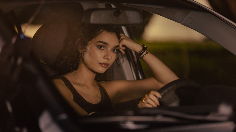 Ariana Medina sitting in the driver's seat of a car in "Landman"