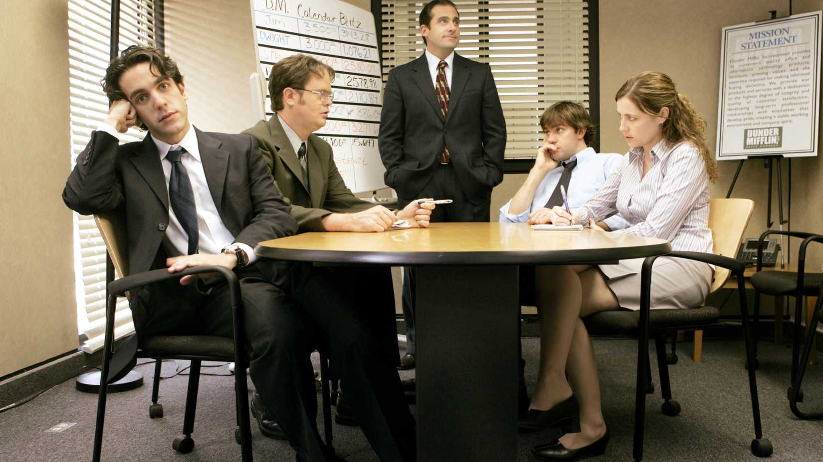 B.J. Novak, Rainn Wilson, Steve Carell, John Krasinski, and Jenna Fischer in a meeting room in The Office