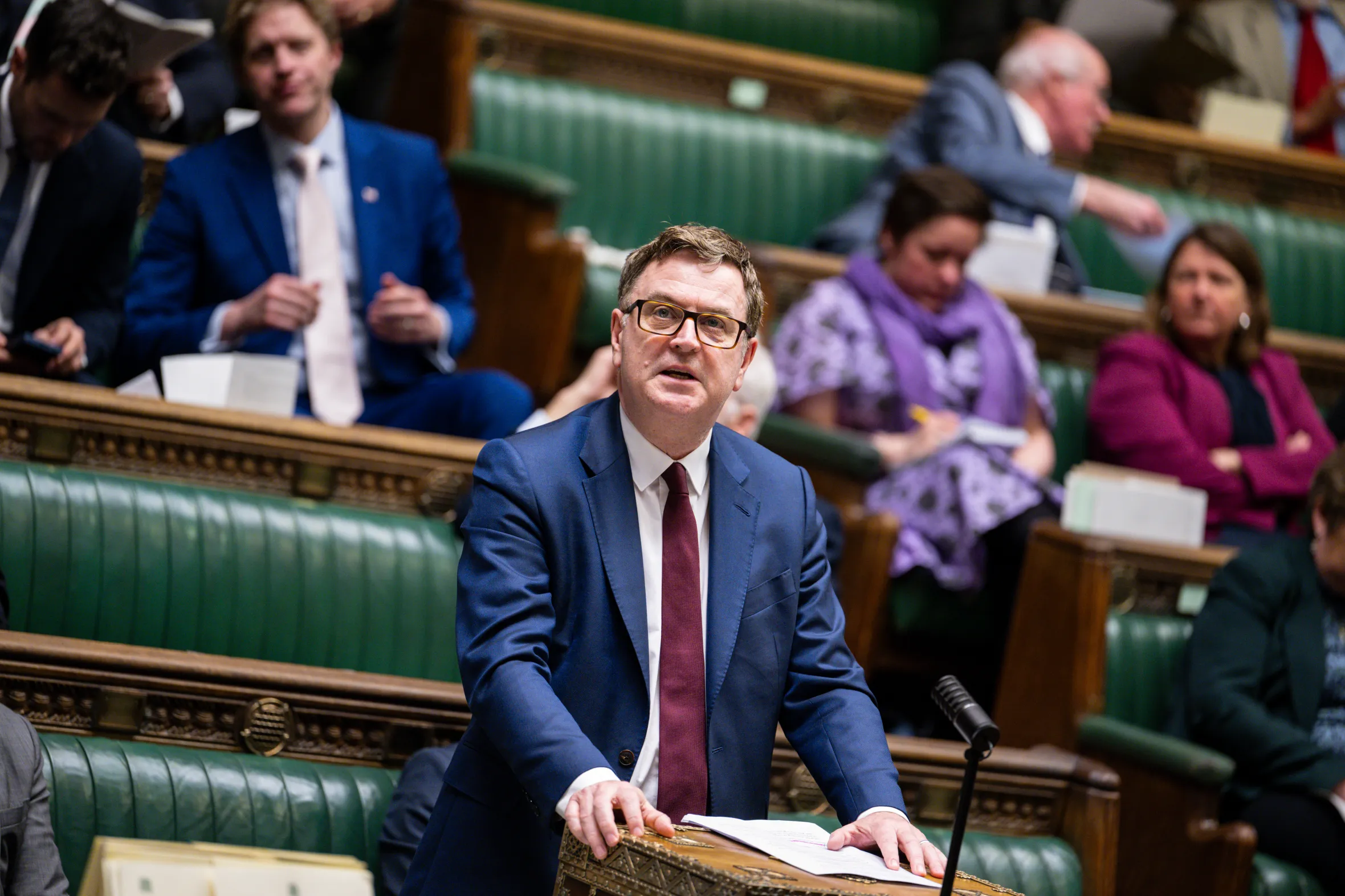Mel Stride speaking at a podium in Parliament.